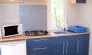 Cottage Duo 2P - Camping Le Bourdieu, cuisine avec four à gaz et évier