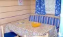 Cottage Duo 2P - Camping Le Bourdieu : table avec couverture et chaises