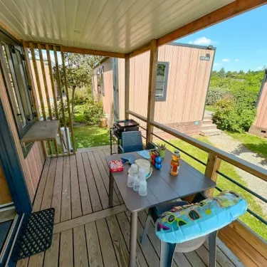 Terrasse du cottage Cottage Evasion 3 Chambres 6 Personnes - Camping Paradis L'Arada Parc