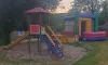 Camping des Bastides - aire de jeux avec toboggan et manège gonflable